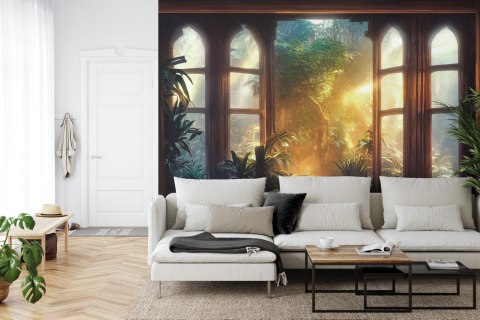 Fototapeta A Large Arch-Shaped Window, A Portal In The Dark Mystical Forest, The Sun's Rays Pass Through The Window And Tre