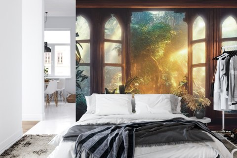 Fototapeta A Large Arch-Shaped Window, A Portal In The Dark Mystical Forest, The Sun's Rays Pass Through The Window And Tre
