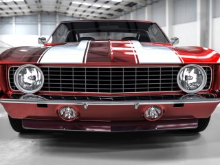 Obraz Wieloczęściowy Czerwony Muscle Car W Garażu